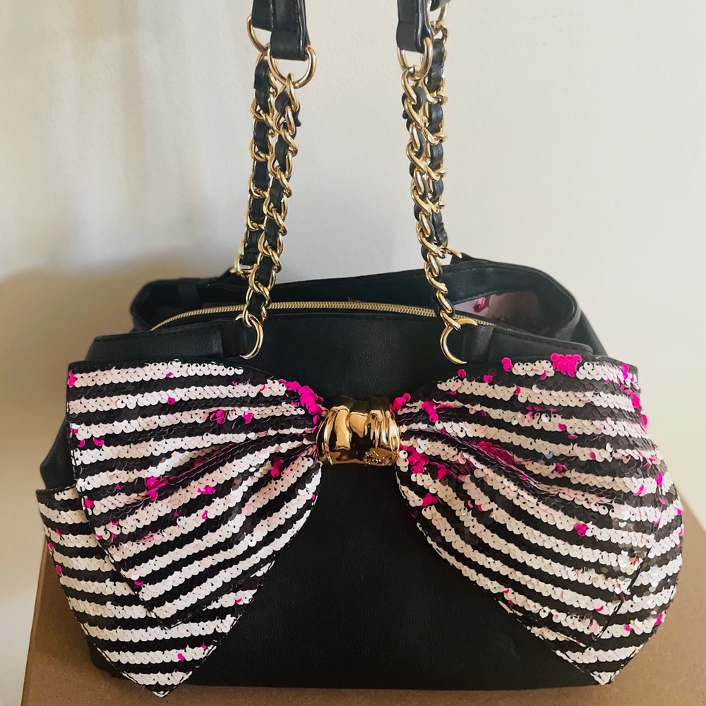 Betsey Johnson Bow-lesque handbag with reversible pink and striped sequin bow